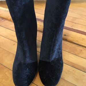 Block heel velvet booties with a floral pattern.